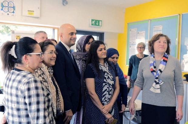 Sajid Javid poses for a photograph with women from a community based english language class.